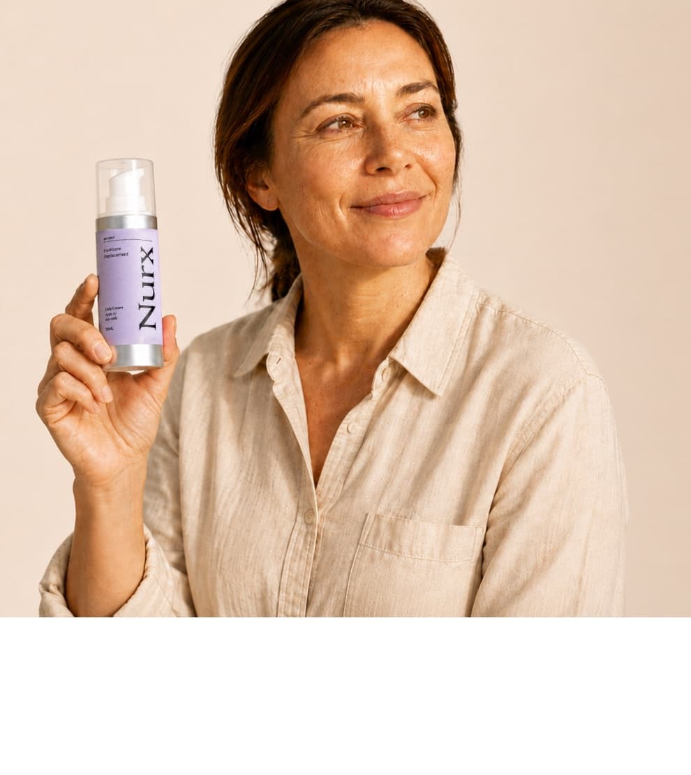 Nurx patient holding a bottle of prescribed hormone therapy
